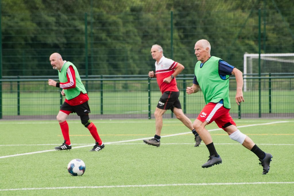 A group of men playing a game of soccer
